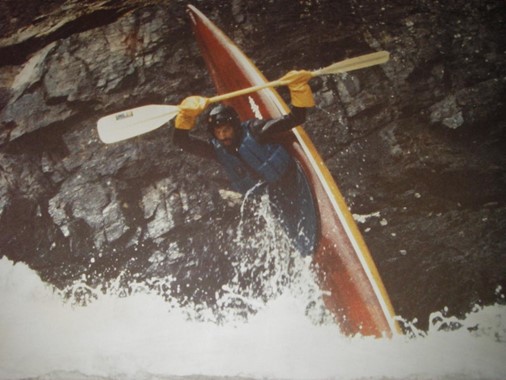 Kayaker from the 1990s performing a vertical maneuver